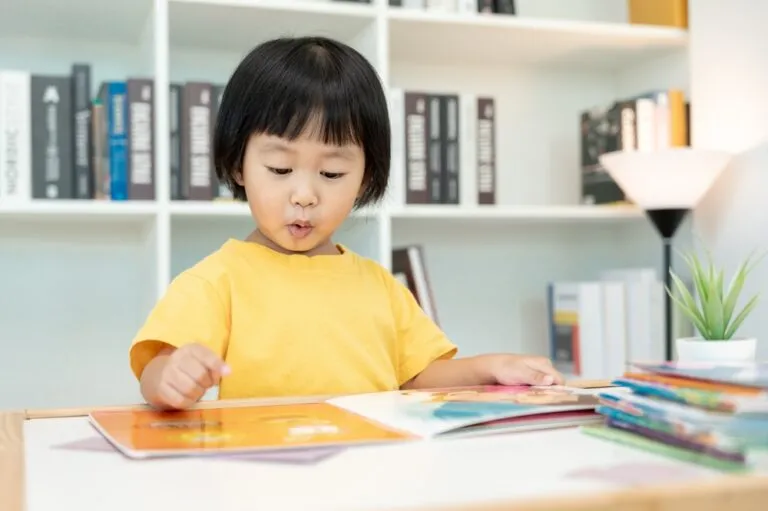 Happy,Asian,Children,Relax,Read,Book,At,Home.,Daughter,And